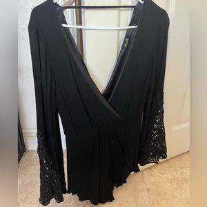 Black romper with lace detailing on sleeves